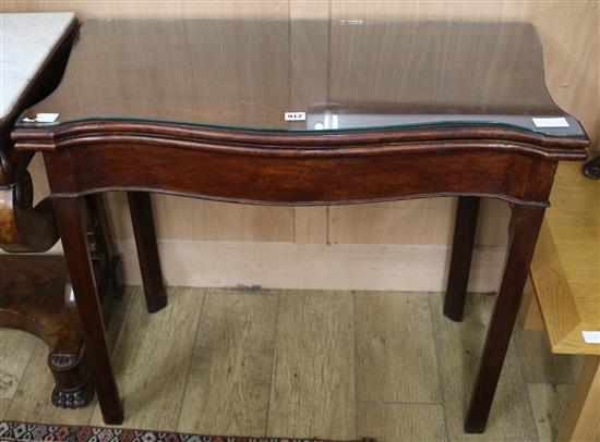 A George III serpentine mahogany card table W.89cm